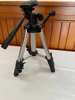 Tripod partially extended showing head, legs, locks