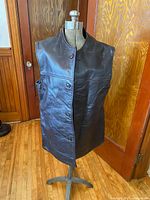 Full view of leather jerkin vest on mannequin