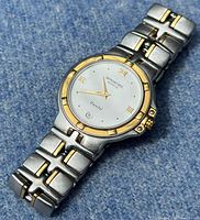 Front view of watch showing dial, bezel and two-tone bracelet