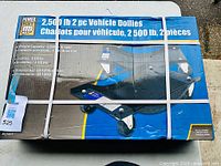 Boxed Power Fist 2 piece vehicle dollies set showing product image and branding.