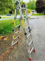 Overall view of ladder in A-frame configuration on driveway
