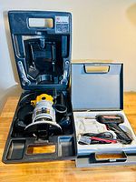 Black & Decker Deluxe Router in black hard plastic molded case with accessories slots