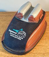 Top view of Edgewood Original shooting bag showing black cordura top with embroidered logo and brown leather sides.