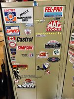 Closed view of cabinet showing exterior stickers and condition