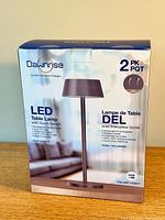 Front view of DaVrinse branded box showing 2-pack LED table lamps with touch switch and USB rechargeable feature.