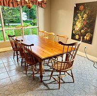 Full view of table and all eight chairs arranged around it