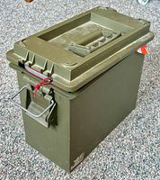 Closed green plastic utility box with handle