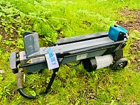 Side view of electric log splitter assembled on ground