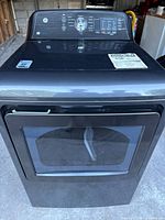 Front exterior view showing door, control panel and graphite steel finish.