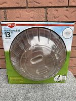 Front view of Kaytee Run-About Ball box showing clear plastic exercise ball for small animals, 13 inch size.