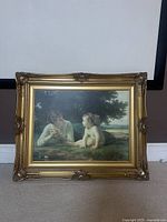 Front view of the framed print showing the artwork and ornate gold frame.