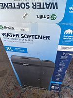 Front of branded AO Smith box showing 'Water Softener with Audible Salt Alerts', 'XL 40,000 Grain Capacity'