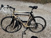 Full side view of Bianchi Giro road bike on gravel showing frame, fork, wheels and saddle