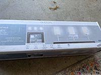 Box showing Quoizel branding and image of the 3-light vanity light with chrome finish and opal etched glass shades.