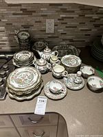 Full lot view on countertop showing assorted China pieces