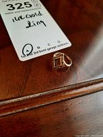 Front view of ring showing rectangular bezel and milgrain border