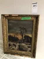 Front view of framed landscape painting showing a dark scene with trees, a man and a dog, and an ornate gold frame with wear.