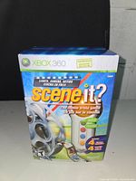 Front view of Xbox 360 Scene It? game box with colorful design and branding.