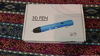 Closed box showing image and label of blue 3D printing pen kit