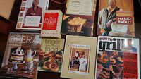 Cookbooks including Martha Stewart's Handbook, The Fannie Farmer Cookbook, Daniel Vaughn book, Molto Italiano by Mario Batali, Opera Lover's Cookbook, Finger Food, Emeril Delmonico, and How to Grill by Steven Raichlen.