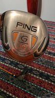 Close-up image of the Ping G10 driver clubhead showing branding, loft (10.5°), and titanium material marking.