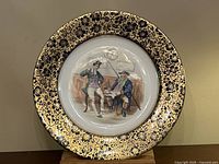 Full view of the Wedgwood cabinet plate showing the central image and ornate border