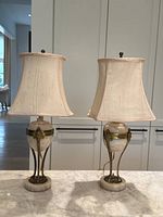 Front view of both lamps with shades on marble countertop