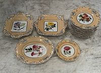 Overview of 16-piece set including square plates, oval dish, and stacked round plates