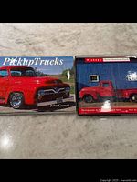 Two coffee table books on classic American pickup trucks with covers visible, showing minor wear.