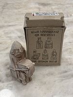 Resin Lewis Chessmen knight figurine with original box labeled in Norwegian and English, showing front and side views