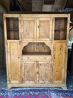 Full front view of pine baker's cabinet showing overall form and finish