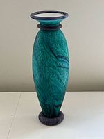 Full view of vintage turquoise and purple art glass vase with flared rim and rounded base ring.