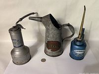 wide shot of all three oilers for scale and condition