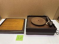 Record player base with felt platter and detached wood lid