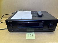 Front and top view of receiver with manual and remote