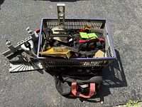 overall view of crate with tool bags and metal guides