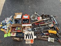Full lot overview with hand tools, hardware, boxed and cased items