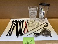 Entire barware lot laid out on white board