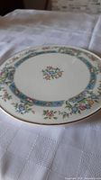 Full view of the cake plate showing floral border and central floral motif.
