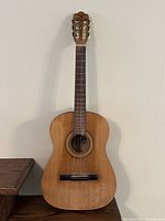 Full frontal view of the Framus acoustic guitar showing the natural wood finish and body shape.