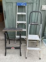 Photo of the three items together: Job Mate work table, 5-foot aluminum a-frame ladder, and aluminum 2-step ladder.