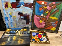 Four paintings displayed, showing various art styles including abstract and figurative forms. Urban night painting included.