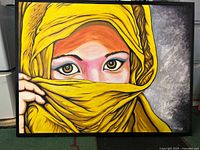 Front view of oil painting showing yellow veiled woman in black frame on floor