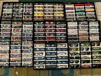 Multiple display trays filled with rows of packaged eyeglass frames