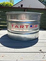 Photo of the tank from the front showing TARTER brand label.