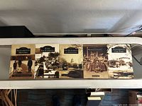 Five Images of America Sacramento history books lined up, titles visible including Midtown, East Sacramento, Old Sacramento and Downtown, Yolo County, and Oak Park editions.