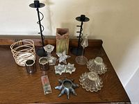 Overview of all 14 candle holders and decorative items showing various materials, designs, and colors.