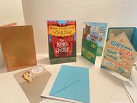 Five Father's Day cards arranged upright and one envelope in frame.