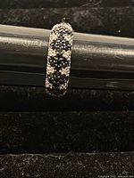 Front view of the sterling silver ring with black and clear Swarovski crystals showing detailed setting on the band.