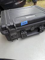 Closed black Maximum heavy duty tool case with label #03 attached on top showing normal wear and tear.